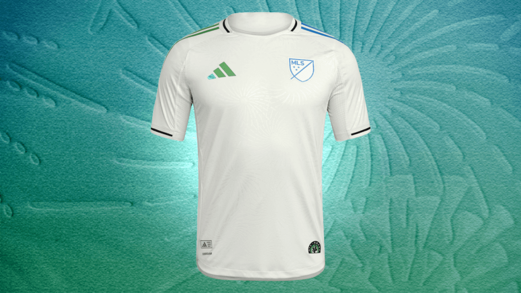 A white MLS All Star jersey featuring the league logo, set against a colorful abstract background.